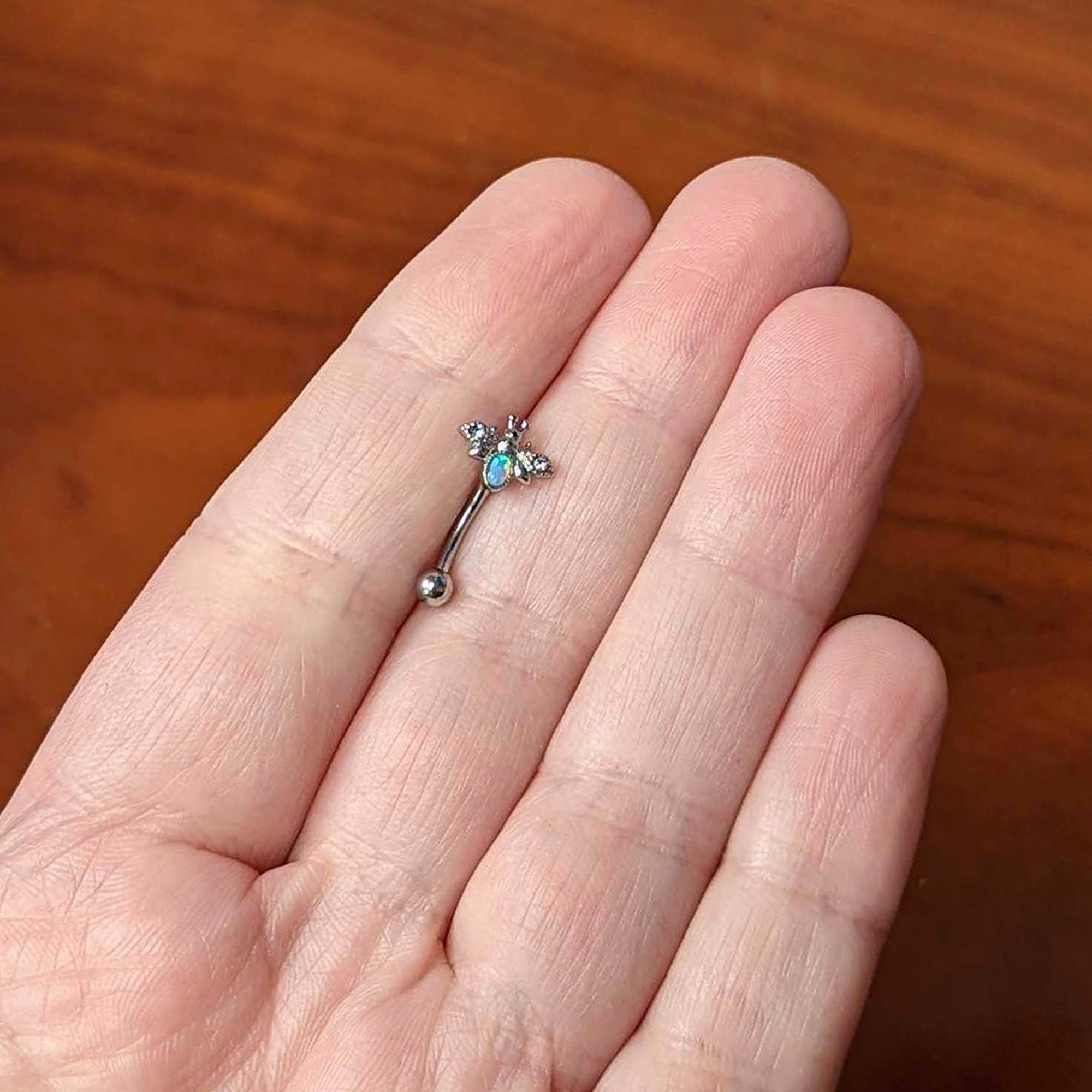 16G 5/16 White Synthetic Opal Insect Curved Eyebrow Ring